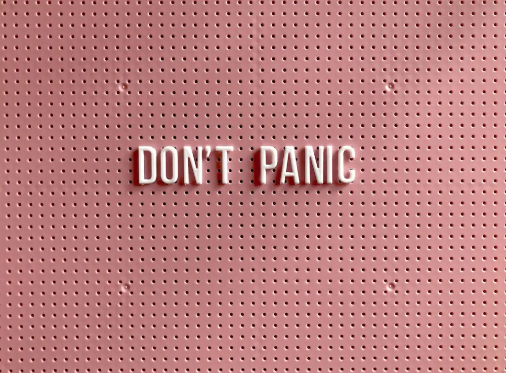 A 'Don't Panic' sign illustrating psychology first aid and crisis stabilization