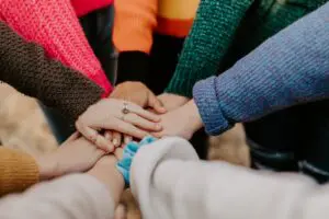 Embracing Diversity in Personality Types Diverse group of people with different personality types joining hands