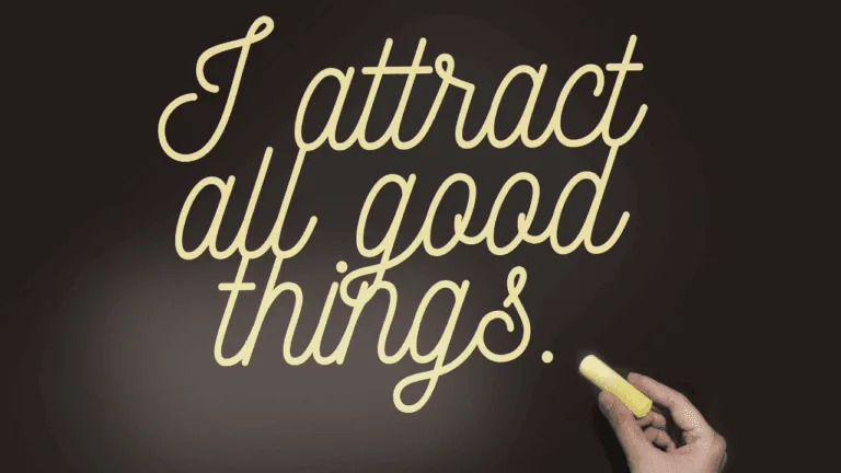 Blackboard with the words 'I Attract All Things Good', symbolizing the law of attraction and manifestation and thinking positive.