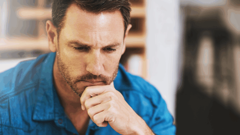Man experiencing mental blocks while deep in thought.