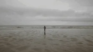 a person walking on a beach