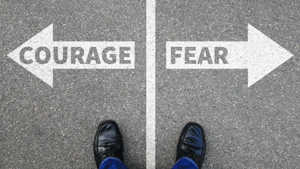 Crossroads showing opposing directions for courage and fear choices