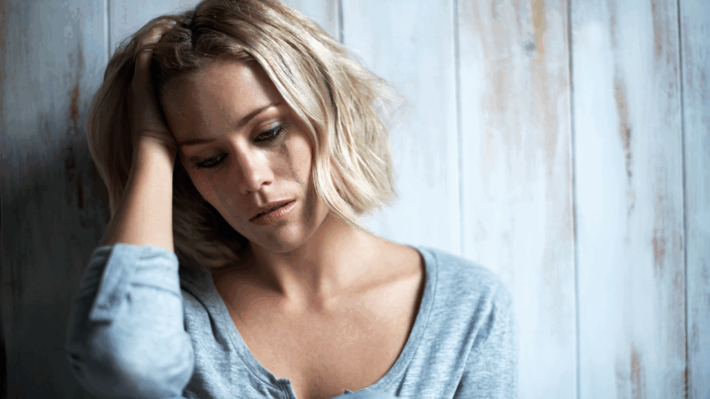 A distressed woman, depicting the emotional toll of hoarding disorder.