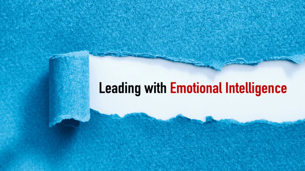 A torn blue paper revealing the phrase Leading with Emotional Intelligence in bold letters.