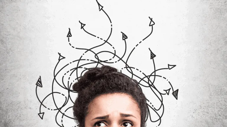Confused woman looking up at tangled arrows representing the counterintuitiveness of the brain and chaotic thought patterns.