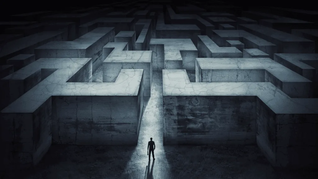 Person standing at the entrance of a dark, complex maze, symbolizing navigating the brain's subconscious resistance to change.