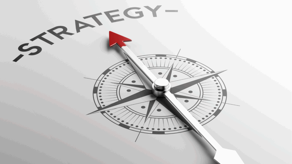 Compass pointing to the word strategy, illustrating that overriding the brain's defaults requires deliberate direction.