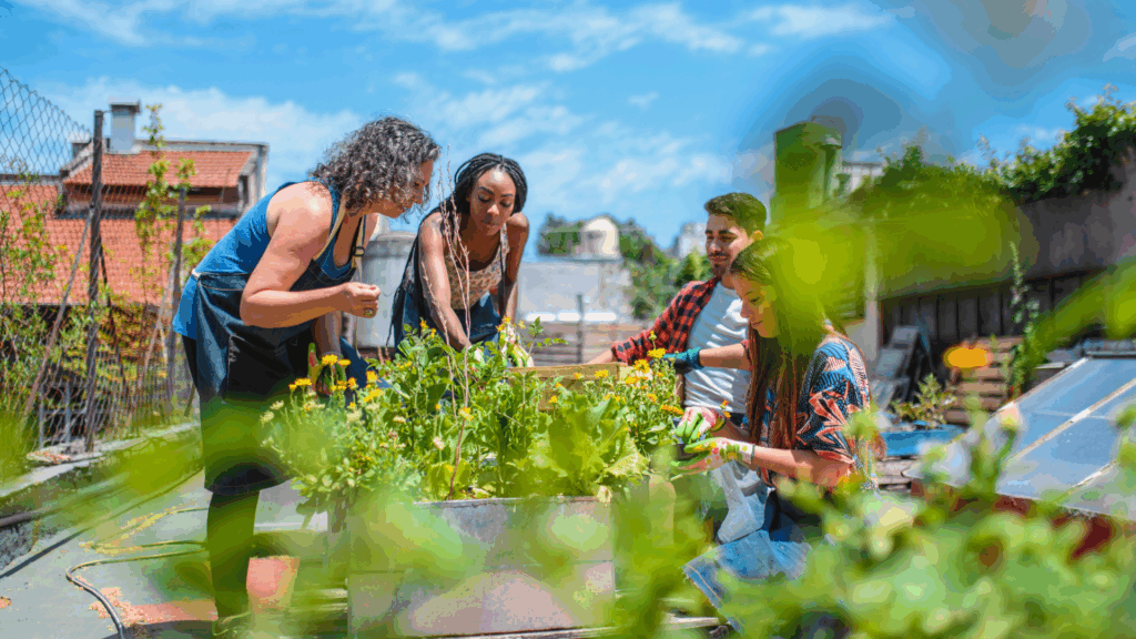Group of people gardening together outdoors, showing the real-world connection a digital detox restores.