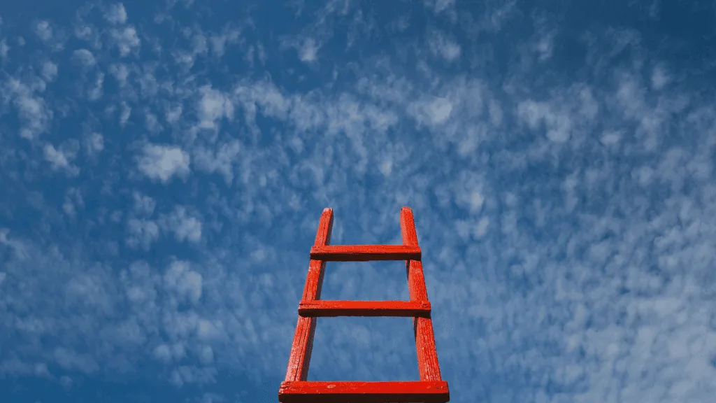 A red ladder reaching toward the sky symbolizes rising levels of dopamine and personal growth.
