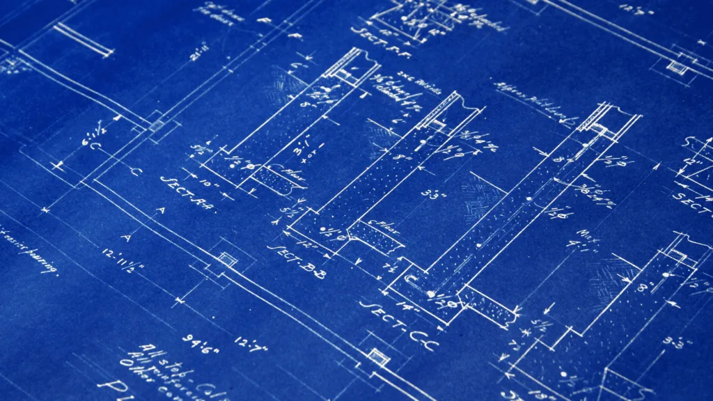 Blueprint plans symbolize the personalized approach of dopamine optimization for brain health.
