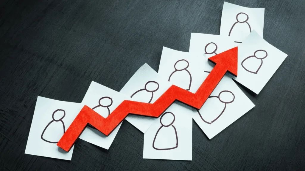 Upward arrow over paper figures, illustrating a leader's impact on growth and team performance.