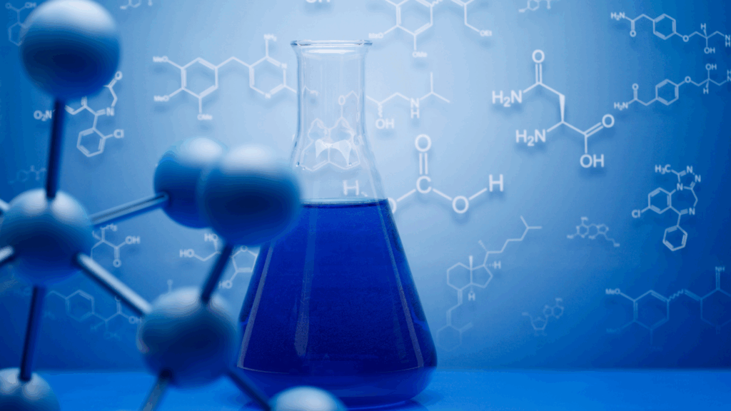 Blue chemistry flask and molecular models, representing how the brain drives motivation through neurochemistry and scientific discovery.
