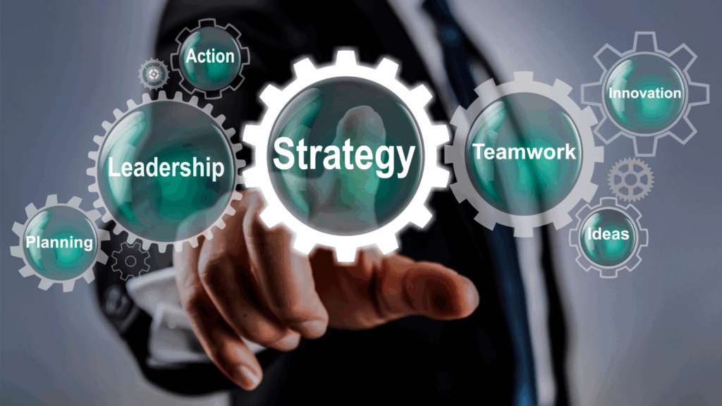 A business professional pointing at gears labeled leadership, strategy, and teamwork, representing hyper independence in the workplace. A professional interacts with virtual gears, showing how hyper independence influences leadership, strategy, and collaboration at work.
