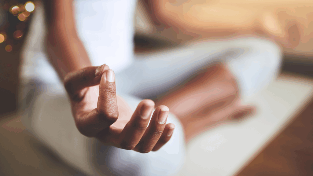 Close-up of hands in a meditation posture, demonstrating a simple mindfulness practice.