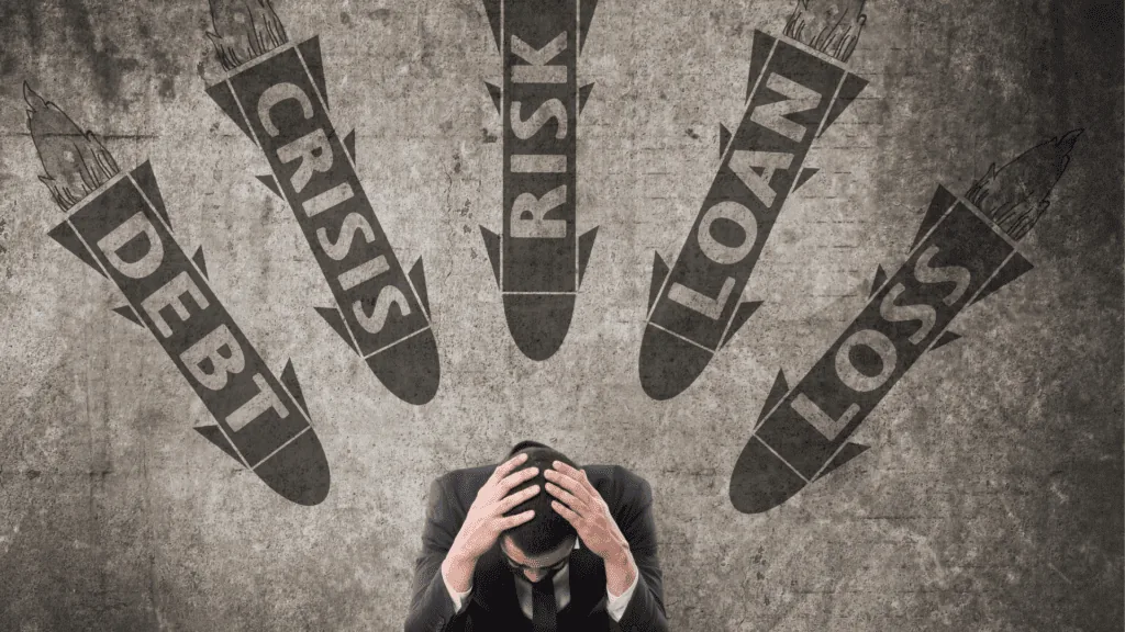 A stressed businessperson holding their head as crisis and debt missiles symbolize the neuroscience of anxiety.