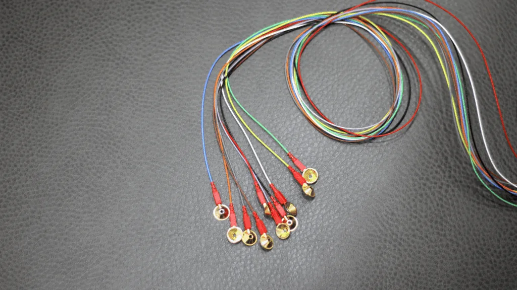 Colorful EEG wires used to study brain activity, essential for understanding the neuroscience of anxiety.