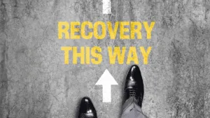 Feet standing before the words "Recovery This Way," symbolizing guidance on how do I stop a panic attack.