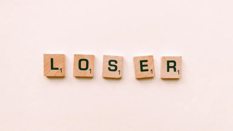 Scrabble tiles spelling loser, representing the inner dialogue of asking, am I a loser.