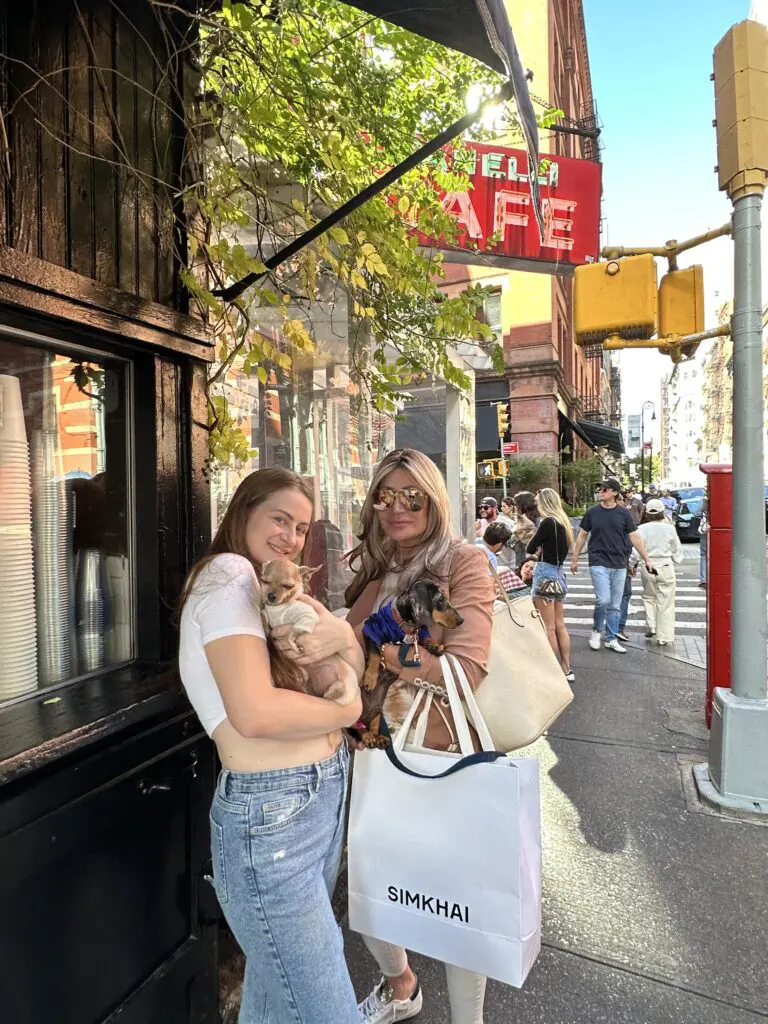 Dr. Sydney Ceruto shopping in SoHo NYC with friend and dogs showing urban lifestyle
