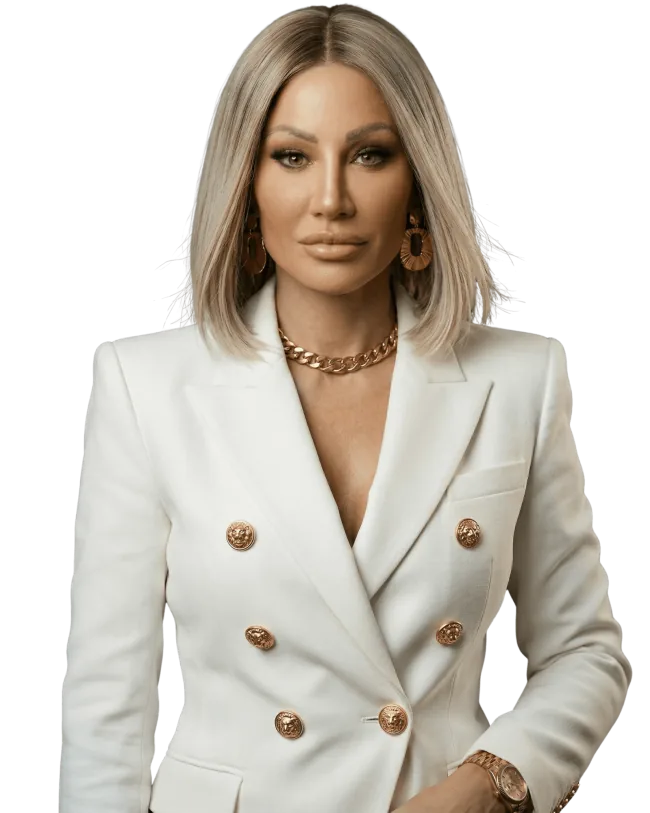 Dr. Sydney Ceruto, PhD, Neuroscientist & Author, in a white suit with gold buttons