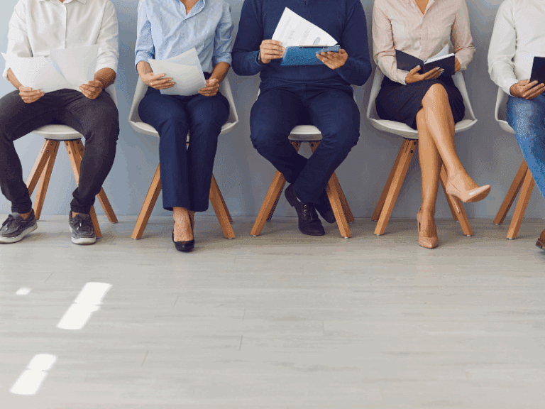 Applicants seated for job interviews, capturing the anticipation and readiness in the process to get an interview.
