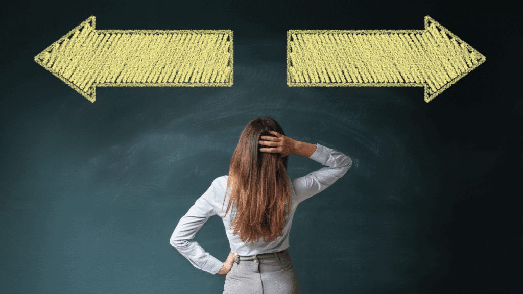 woman looking at blackboard with arrows going in opposite directions and scratching her head about how to make a confitent decision