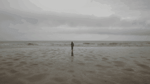 a person walking on a beach