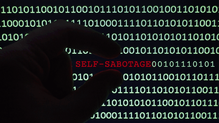 A computer screen with lines of numbers and then the word self-sabotage in red.