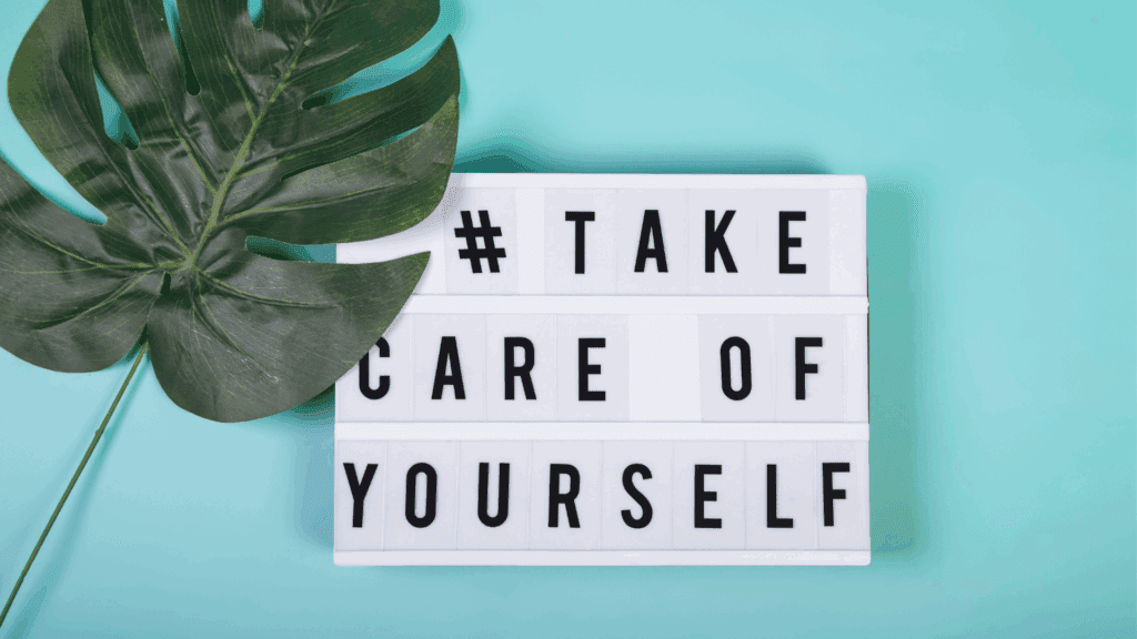 Take care of yourself message on a light box referring to mental well-being A lightbox with the message "# TAKE CARE OF YOURSELF" on a teal background with a green leaf, emphasizing the importance of self-care and mental well-being.