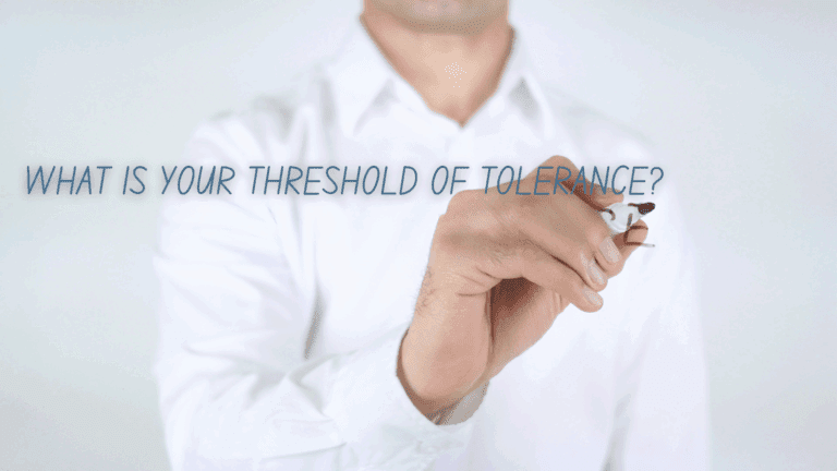 A man writing 'What is your threshold of tolerance?' to introduce the concept of emotional regulation in neuroscience.