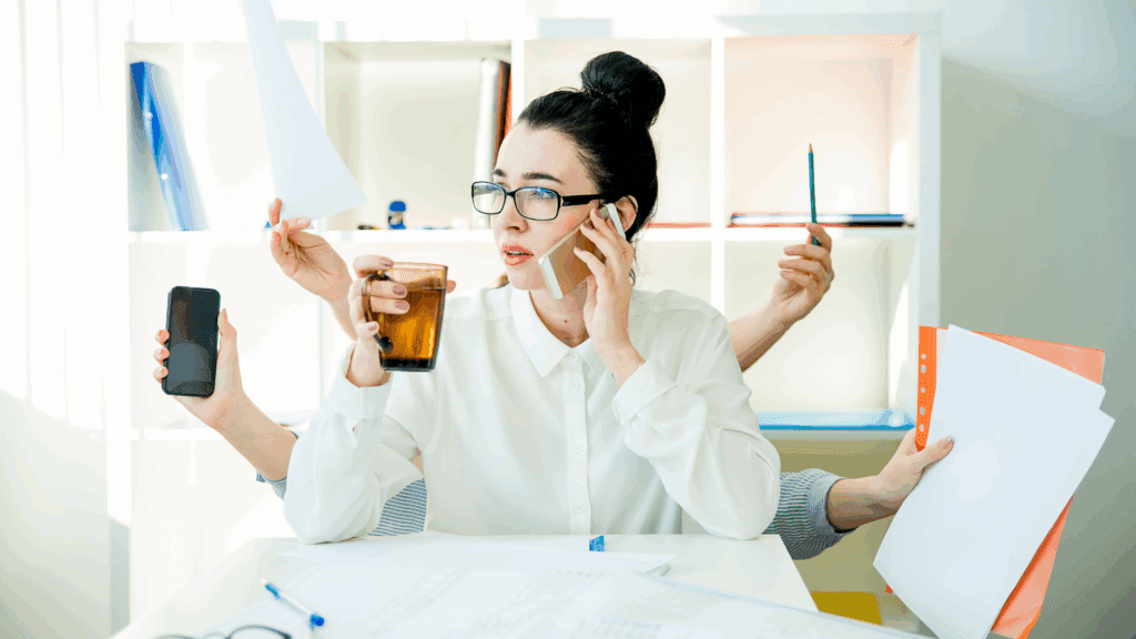 Woman multitasking at a desk, showcasing efficiency of Type A personality traits.

