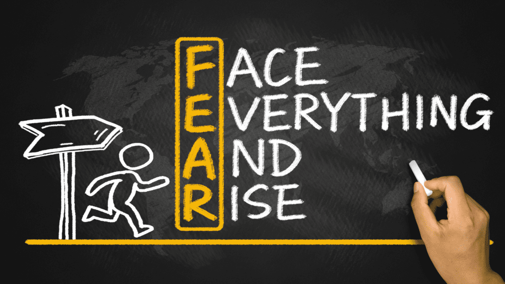Chalkboard illustration of the word "FEAR" redefined as "Face Everything And Rise," symbolizing overcoming anxiety through resilience.

