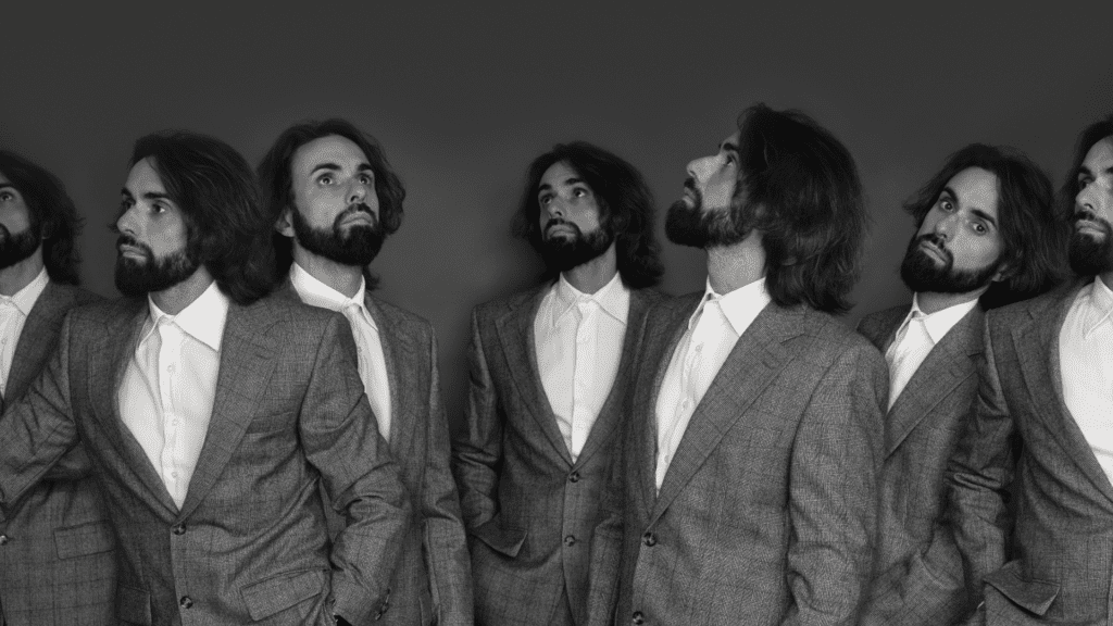A black-and-white image of a man duplicated multiple times in different poses, symbolizing the confusion and fragmentation experienced during a self-identity crisis.

