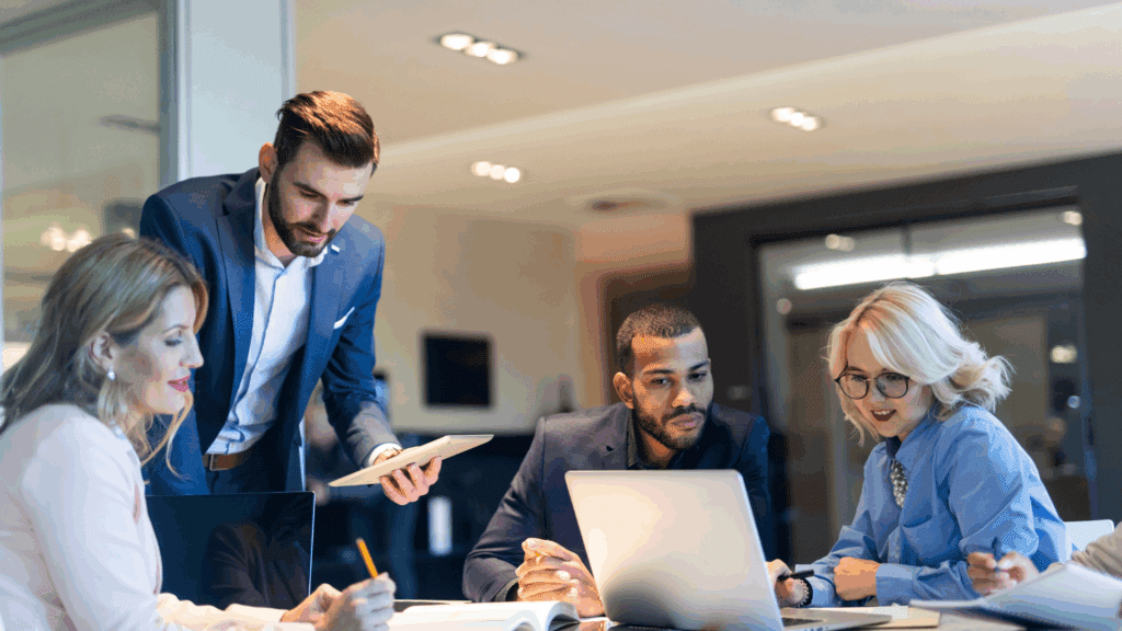 Group of motivated individuals collaborating, demonstrating how surrounding yourself with the right people fosters a success-focused mindset.