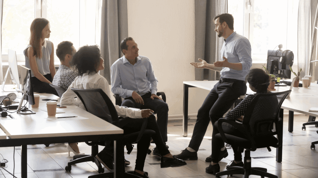 A team collaborating in a meeting to foster appreciation and reduce employees feeling underappreciated at work.




