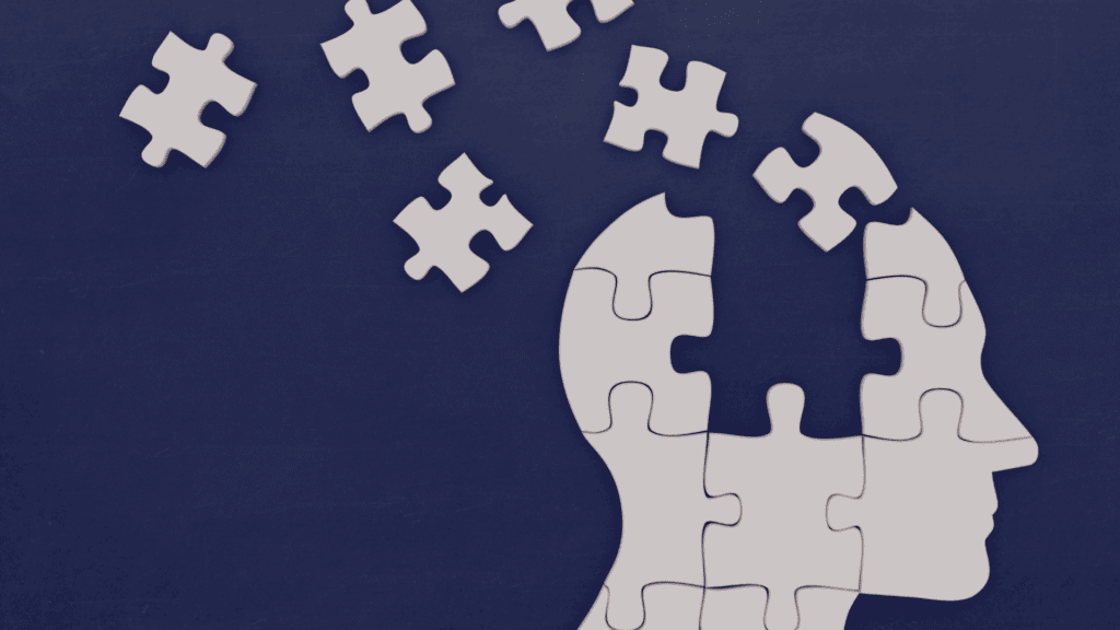 How neurons work concept illustrated by a human head made of puzzle pieces.





