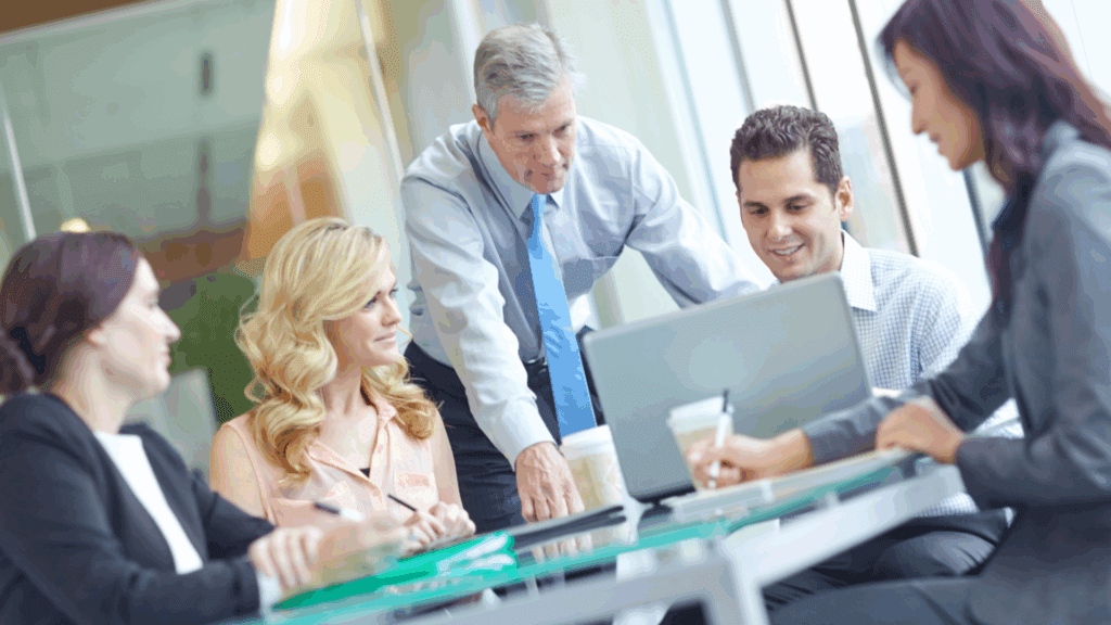 Business team collaborating on neuroscience of a flow state in a modern office.