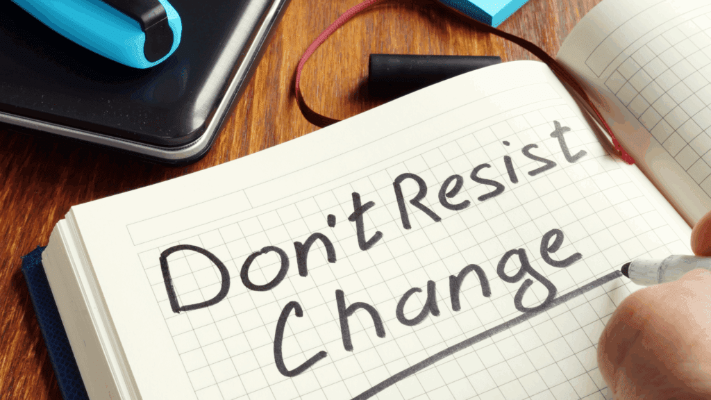 Notebook with the phrase “Don’t Resist Change” illustrating resistance to change and readiness for change.