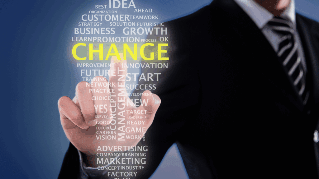 Business professional highlighting the word “Change” to represent resistance to change and readiness for change in organizations.