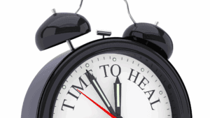 Close-up of a clock reading time to heal, symbolizing recovery and strategies for how do I stop a panic attack effectively.