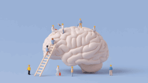 Miniature workers building a human brain model, symbolizing the neuroscience of micro-changes in personal growth.