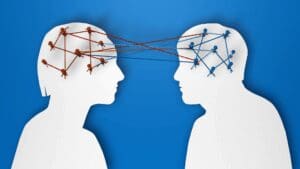 Concept illustration of two connected minds symbolizing shared understanding and emotional regulation through cognitive reappraisal.