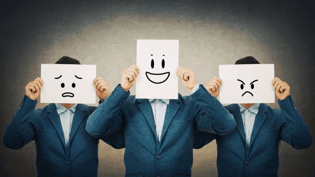 Person holding papers with different facial expressions, representing emotional regulation through cognitive reappraisal.