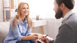 “Coach and client smiling during a positive session, representing success and motivation through Dopamine Coaching Neuroscience.”