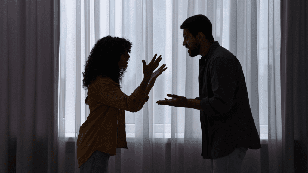Couple arguing intensely indoors, representing emotional conflict and the neuroscience of contentiousness.