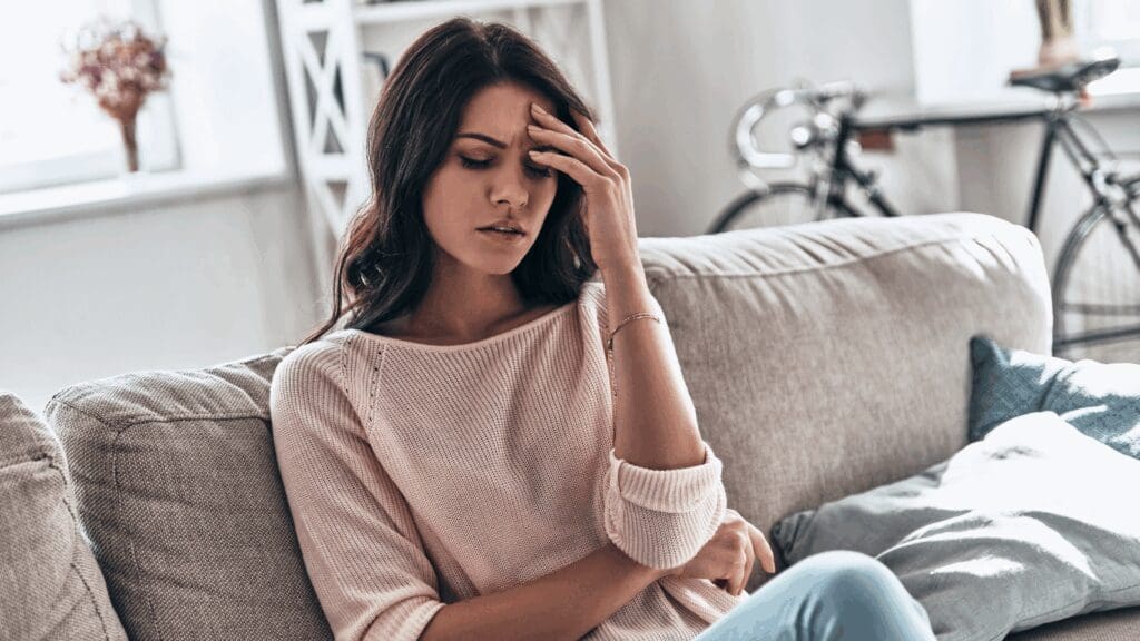 Woman experiencing emotional numbness and stress while feeling blah, showing the need for neuroscience-based support.  