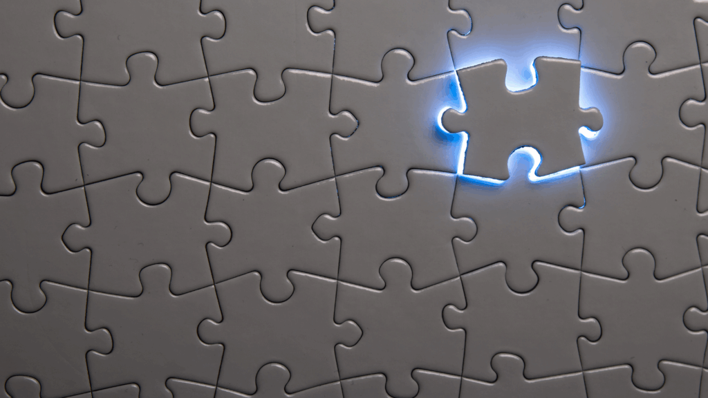 Illuminated puzzle piece shaped like human head representing complete solution in life coaching vs neuroscience coaching