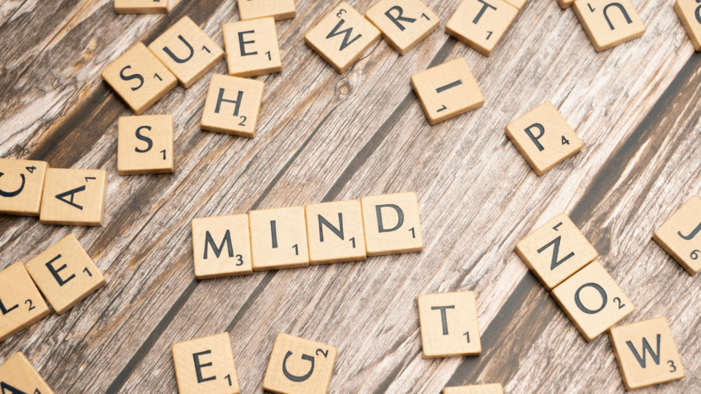 Mind spelled in scrabble tiles illustrating cognitive approach in life coaching vs neuroscience coaching