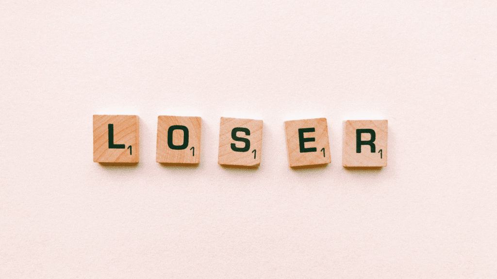 Scrabble tiles spelling loser, representing the inner dialogue of asking, am I a loser.