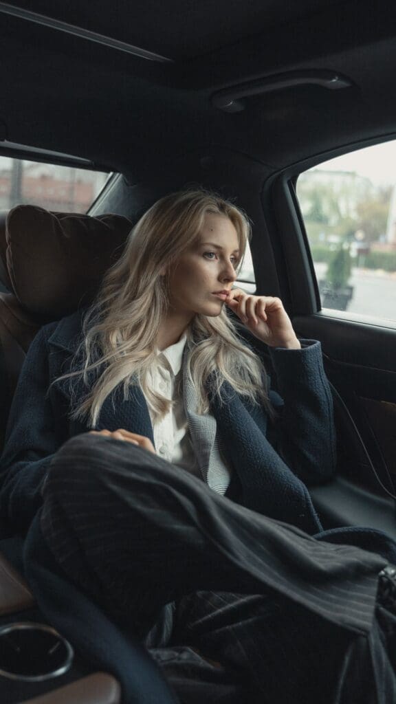 Executive in deep thought riding in a car, visually representing brain neuroplasticity and the mental resilience often required in brain injury recovery, neuroplasticity recovery, neuroplasticity and recovery, and brain plasticity and recovery.